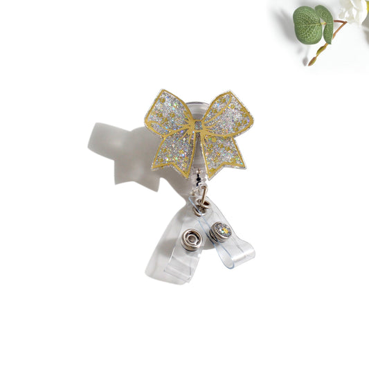 Glitterific Badge Reel Gold Bow